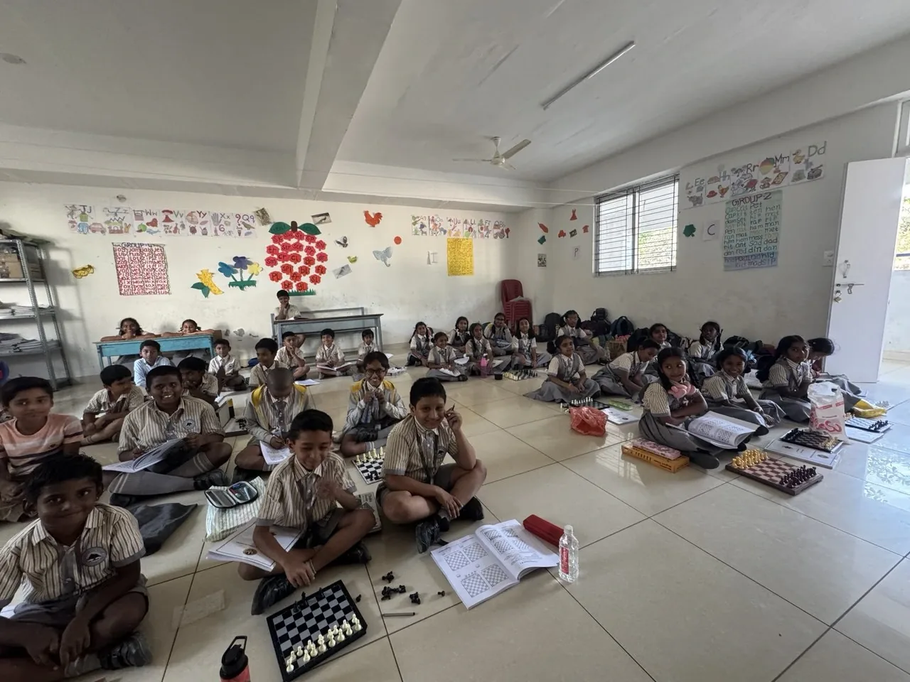 Children engaged in chess training session during school hours